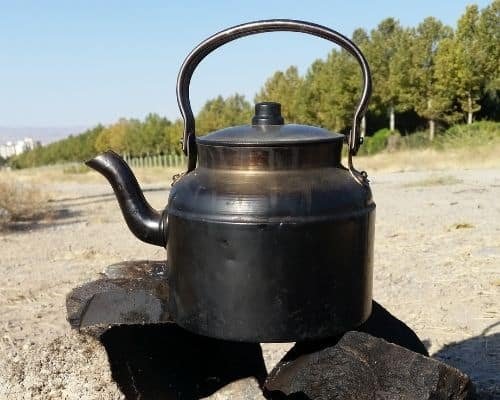 kettle on top of rocks