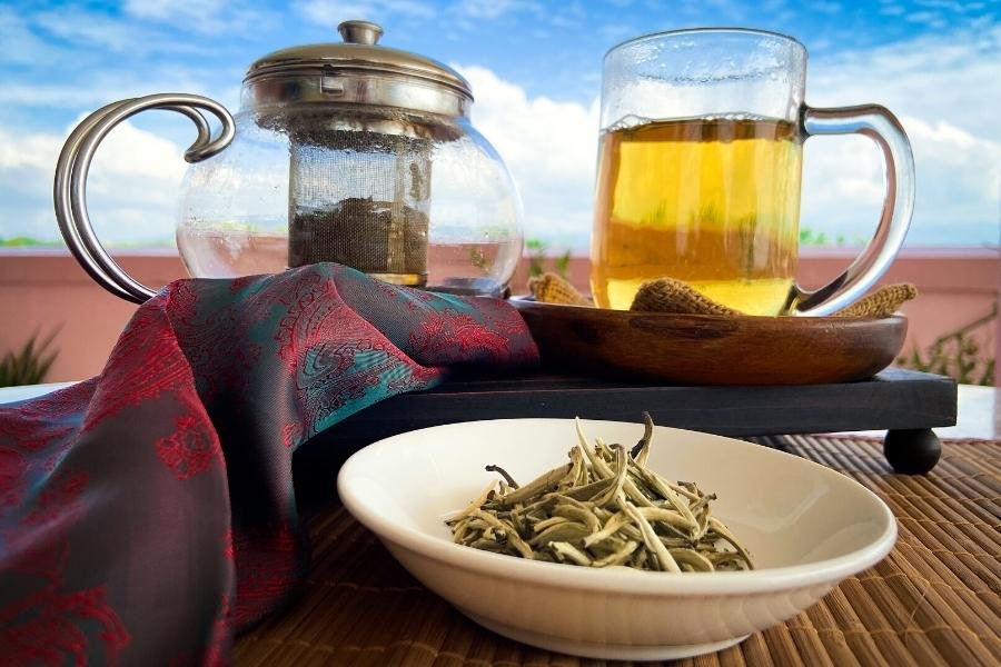 white tea and white tea in a glass cup