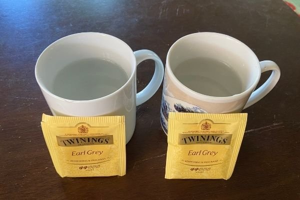 two mugs with water and Twining Earl Grey Tea Bags