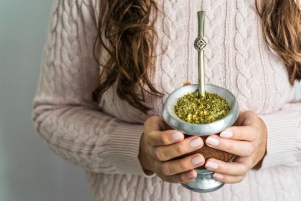 woman and yerba mate tea