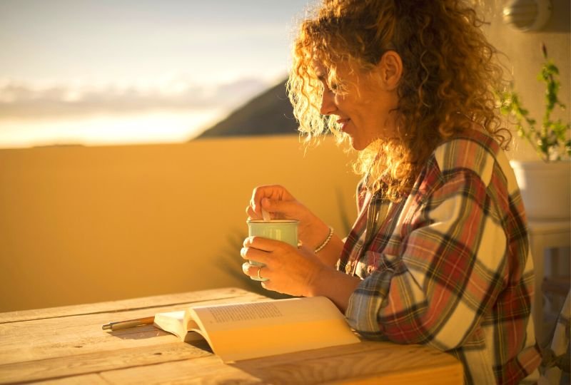 woman drinking tea and studying