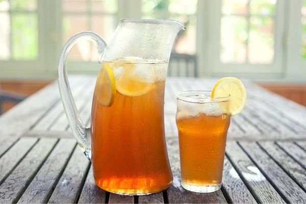 iced tea in a pitcher and glass