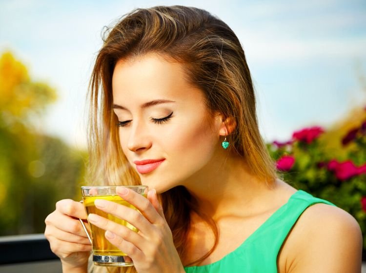 woman drinking green tea